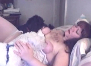 Breasty lady is happy to feed this animal her milk