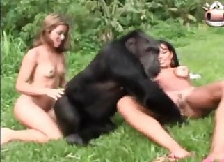 Woman with tanned body and large breasts loves this monkey
